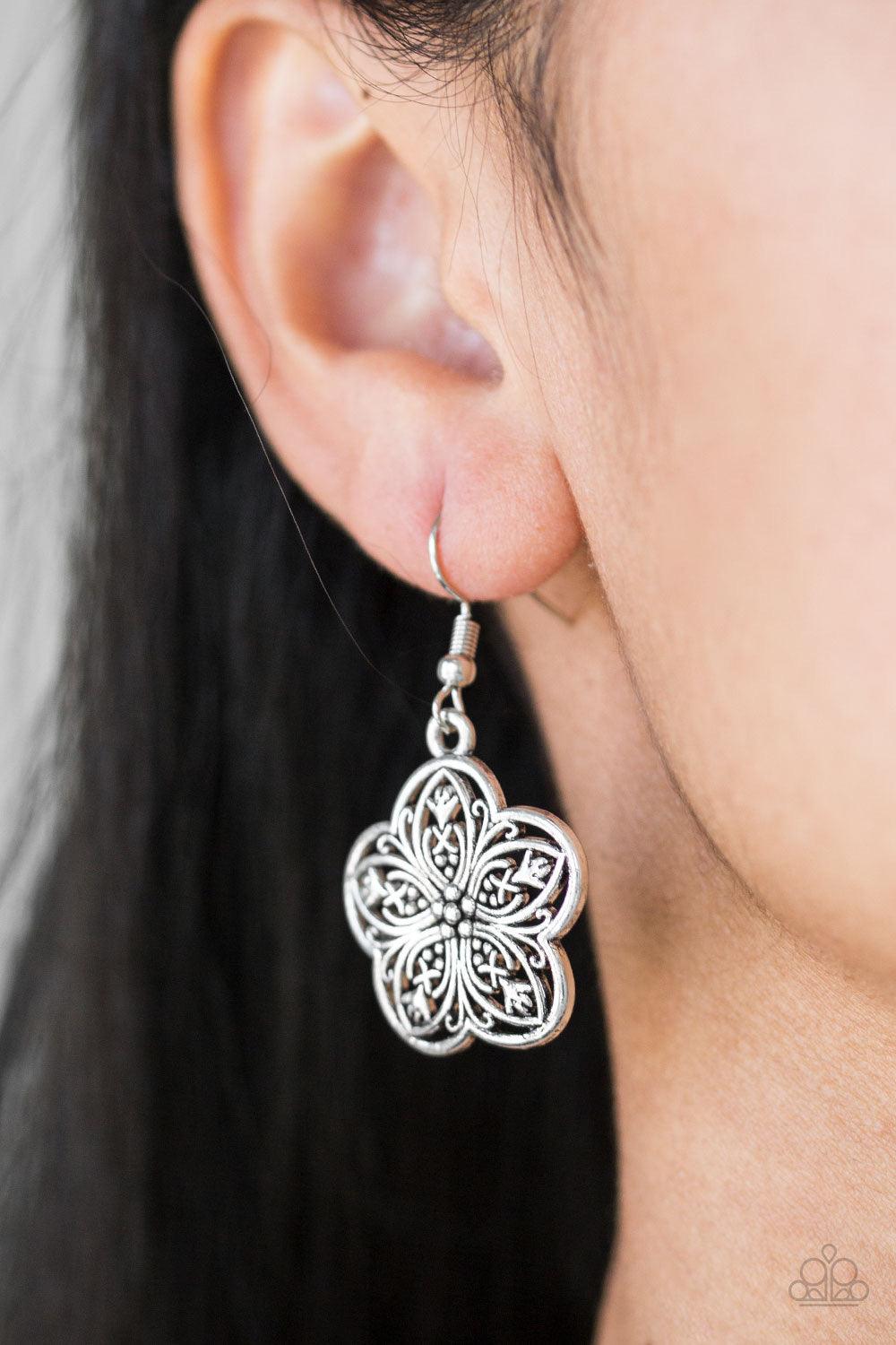 Paparazzi Accessories Garden Groove - Silver Ornate silver flowers connect below the collar for a simply seasonal look. Features an adjustable clasp closure. Sold as one individual necklace. Includes one pair of matching earrings. Jewelry