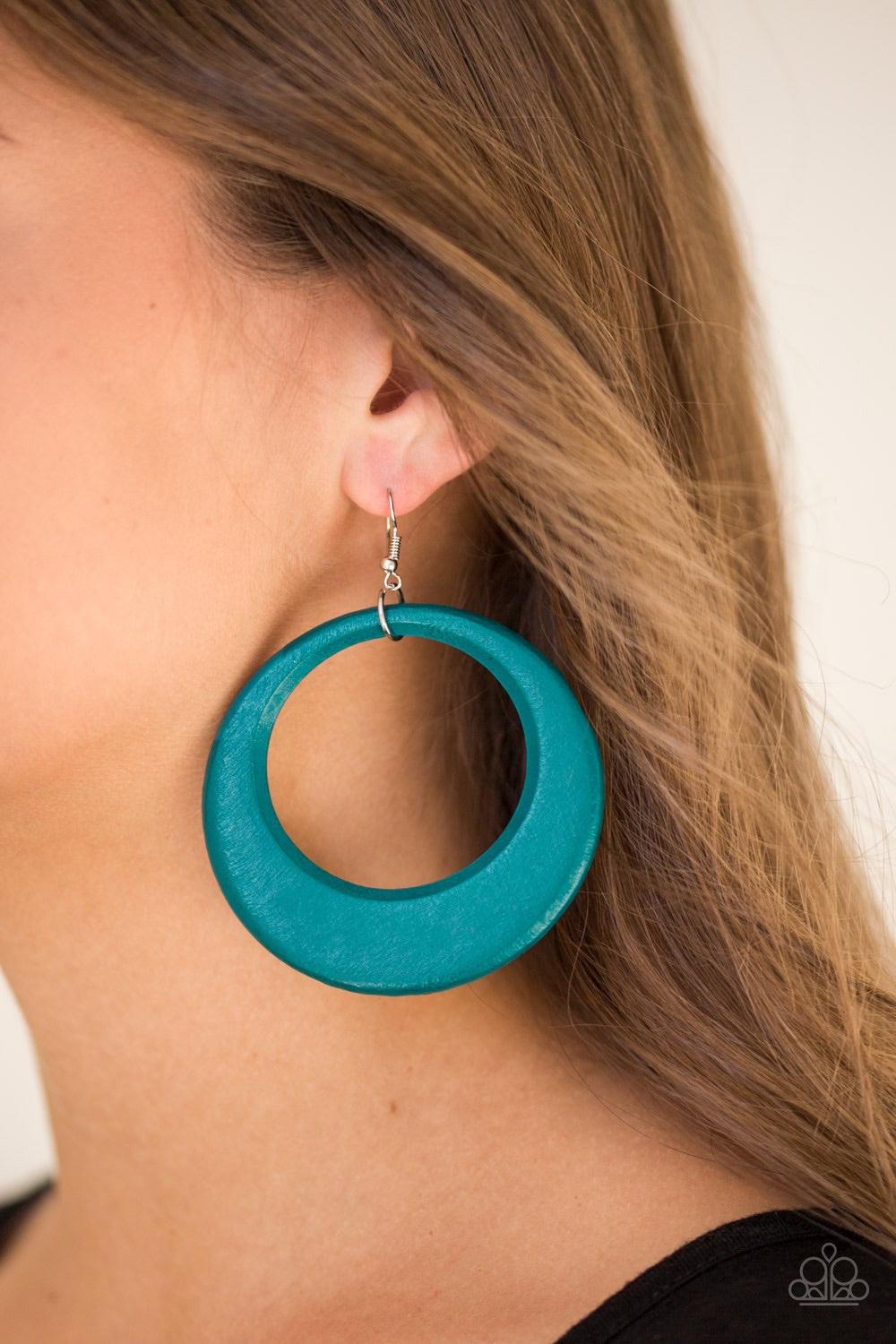 Paparazzi Accessories Modern Malibu Barbie - Blue Brushed in a refreshing blue finish, an airy wooden frame swings from the ear in a seasonal fashion. Earring attaches to a standard fishhook fitting. Jewelry