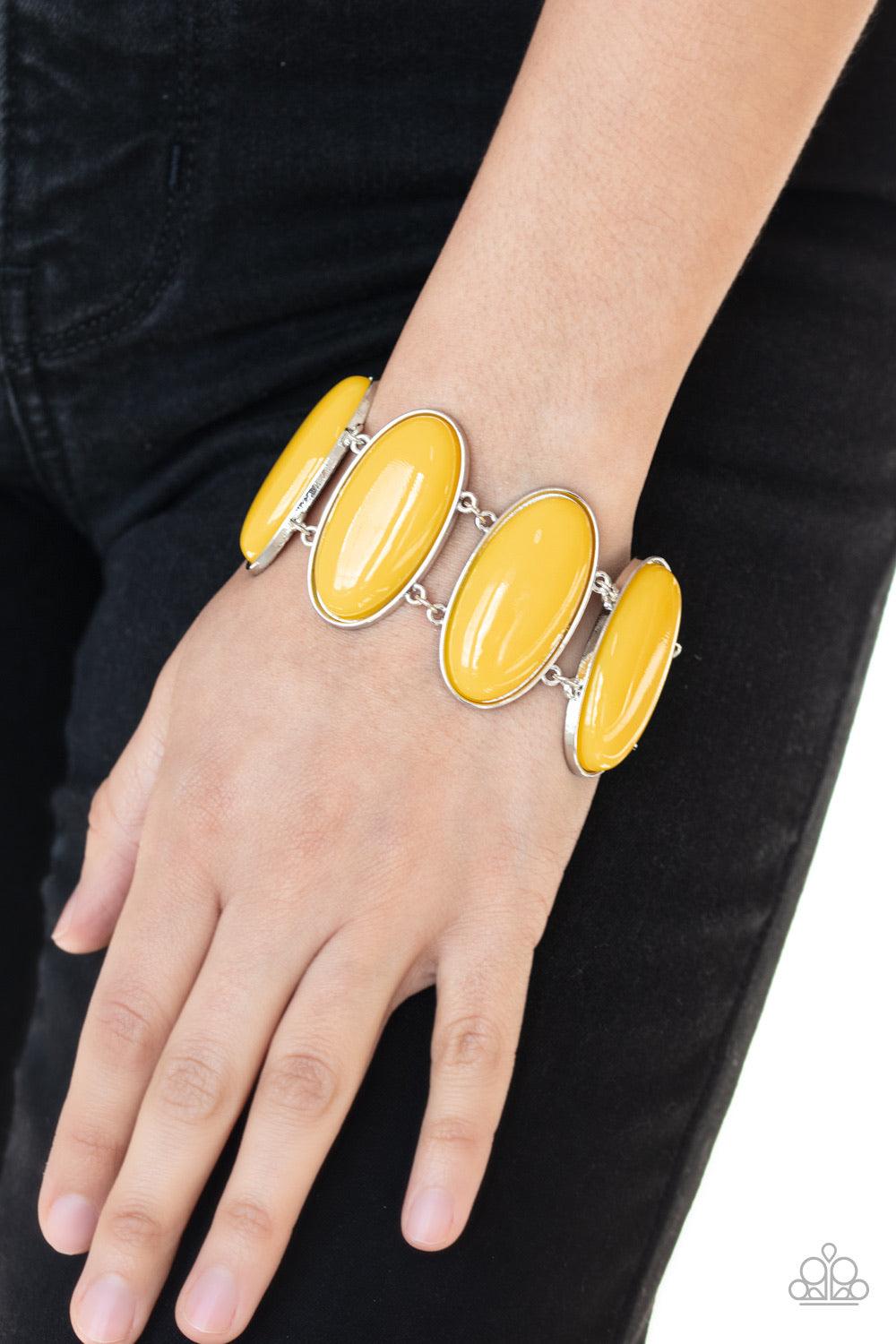 Paparazzi Accessories Power Pop - Yellow Dotted with oblong yellow beaded centers, vibrant silver frames link around the wrist for a powerful pop of color. Features an adjustable clasp closure. Jewelry