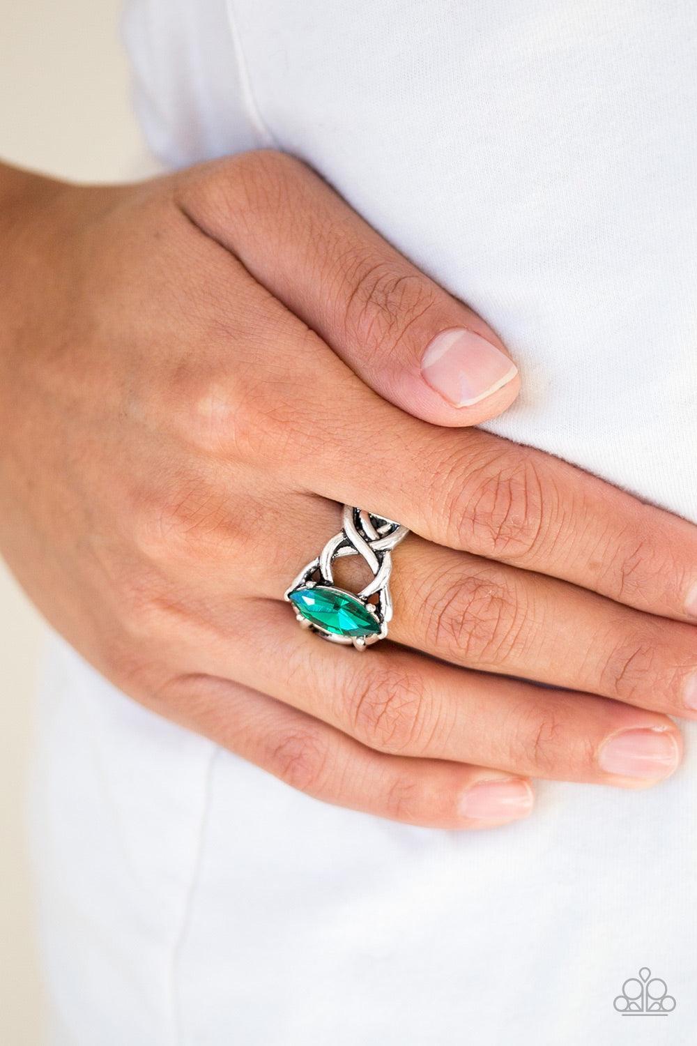Paparazzi Accessories Princess Prima Donna - Green Featuring a regal marquise style cut, a glittery green rhinestone is pressed into the center of a band swirling with silver filigree for a refined look. Features a stretchy band for a flexible fit. Jewelr