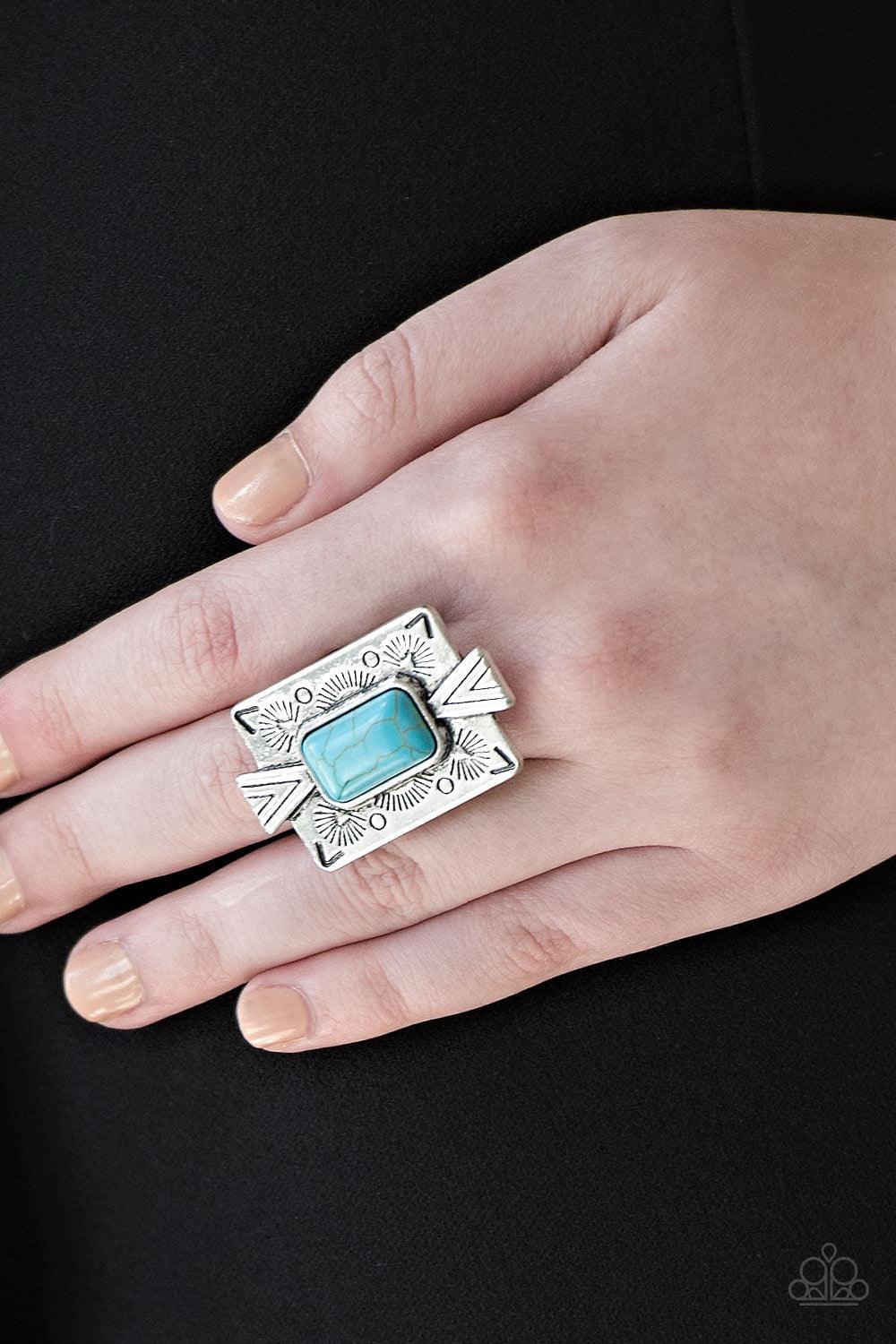 Paparazzi Accessories Stone Cold Couture - Blue Chiseled into a tranquil rectangle, a refreshing turquoise stone is pressed into a bold silver frame radiating with tribal inspired patterns for a seasonal look. Features a stretchy band for a flexible fit.