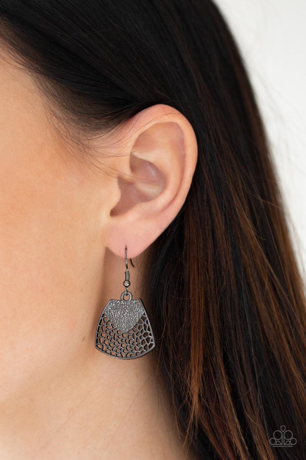 Paparazzi Accessories Large And In Charge - Black Featuring ornately stenciled and embossed details, a flared gunmetal plate swings from a boldly gunmetal beaded chain below the collar for a fierce look. Features an adjustable clasp closure. Sold as one i