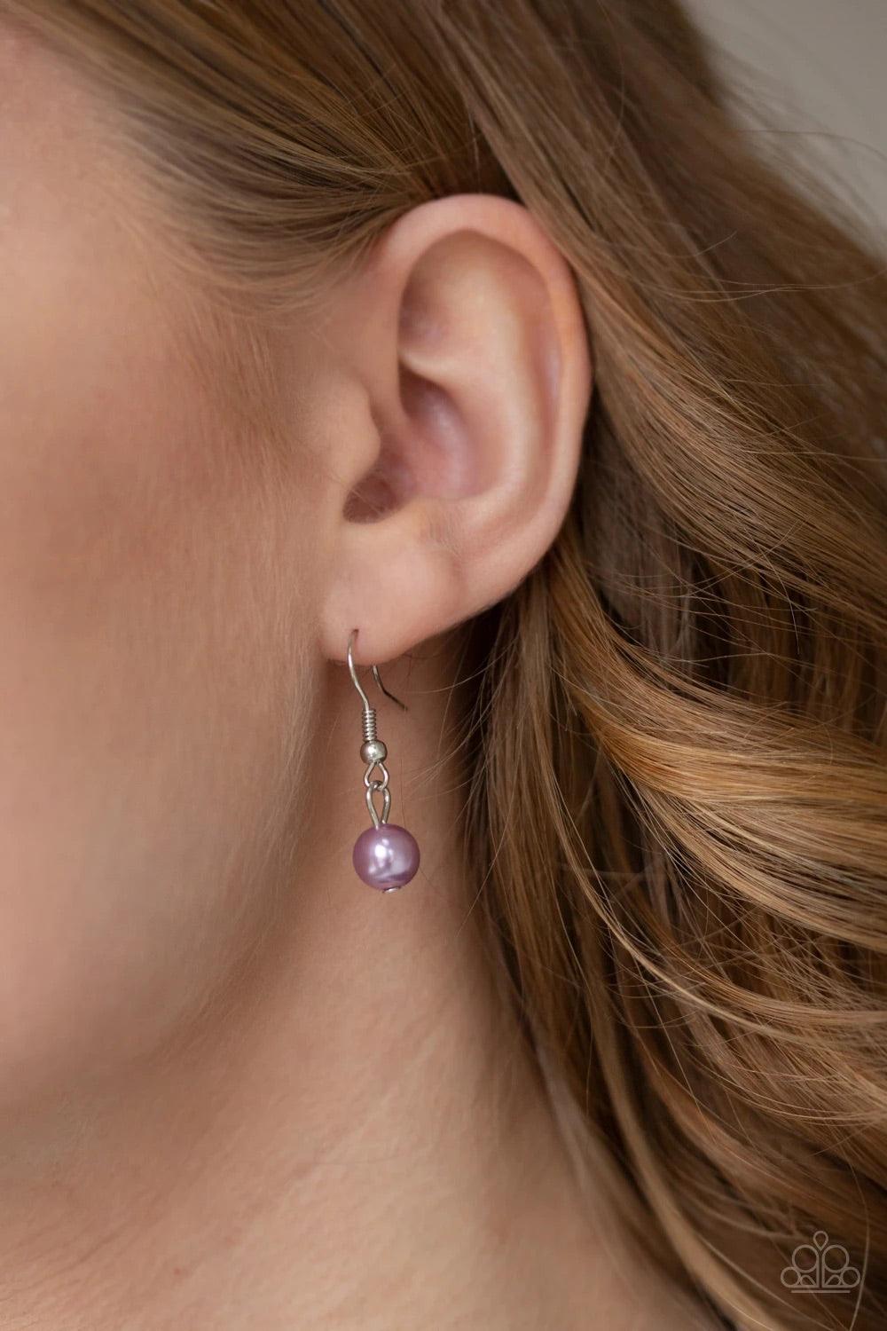 Paparazzi Accessories Kindhearted Heart - Purple A collection of shiny silver beads and pearly purple beads cascade from the bottoms of two layered silver chains. Stamped in the word, "Love" floral heart charms dangle from the lowermost chain, creating a
