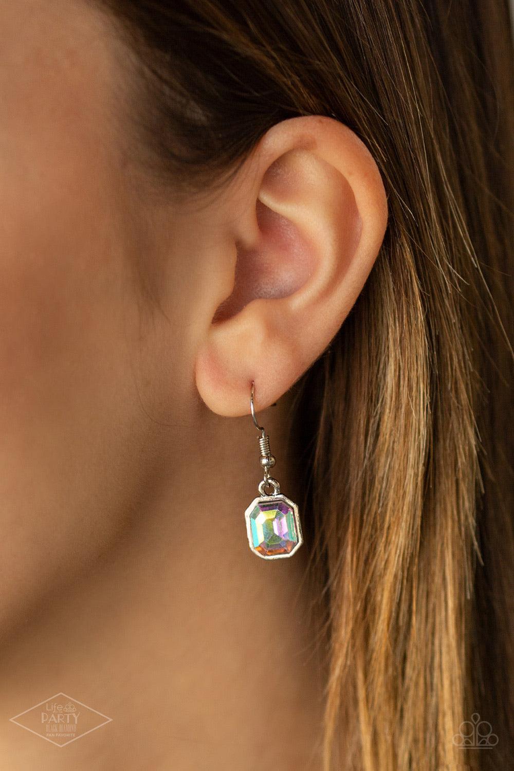 Paparazzi Accessories The Right To Remain - Multi Featuring regal emerald style cuts, glittery iridescent gems link below the collar in an undeniably sparkly fashion. A slightly larger iridescent gem swings from the center, creating an eye-catching pendan