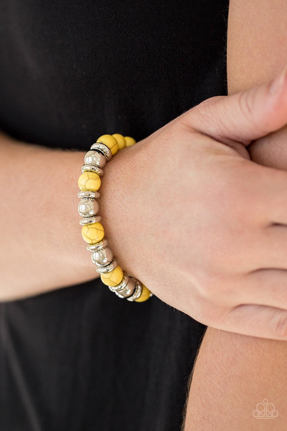 Paparazzi Accessories Across The Mesa - Yellow A collection of silver accents and sunny yellow stones are threaded along a stretchy band for a seasonal look. Jewelry