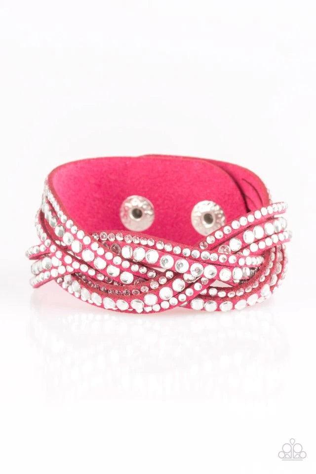 Paparazzi Accessories Bring on the Bling - Pink Varying in size, glassy white rhinestones are encrusted along interwoven pink suede bands, creating blinding shimmer across the wrist. Features an adjustable snap closure. Jewelry