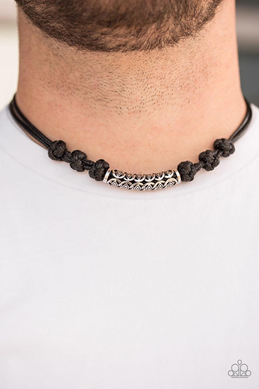 Paparazzi Accessories Jungle Rover - Black An ornate silver bead is knotted in place along strands of shiny black cording, creating an urban look below the collar. Features an adjustable button loop closure. Jewelry