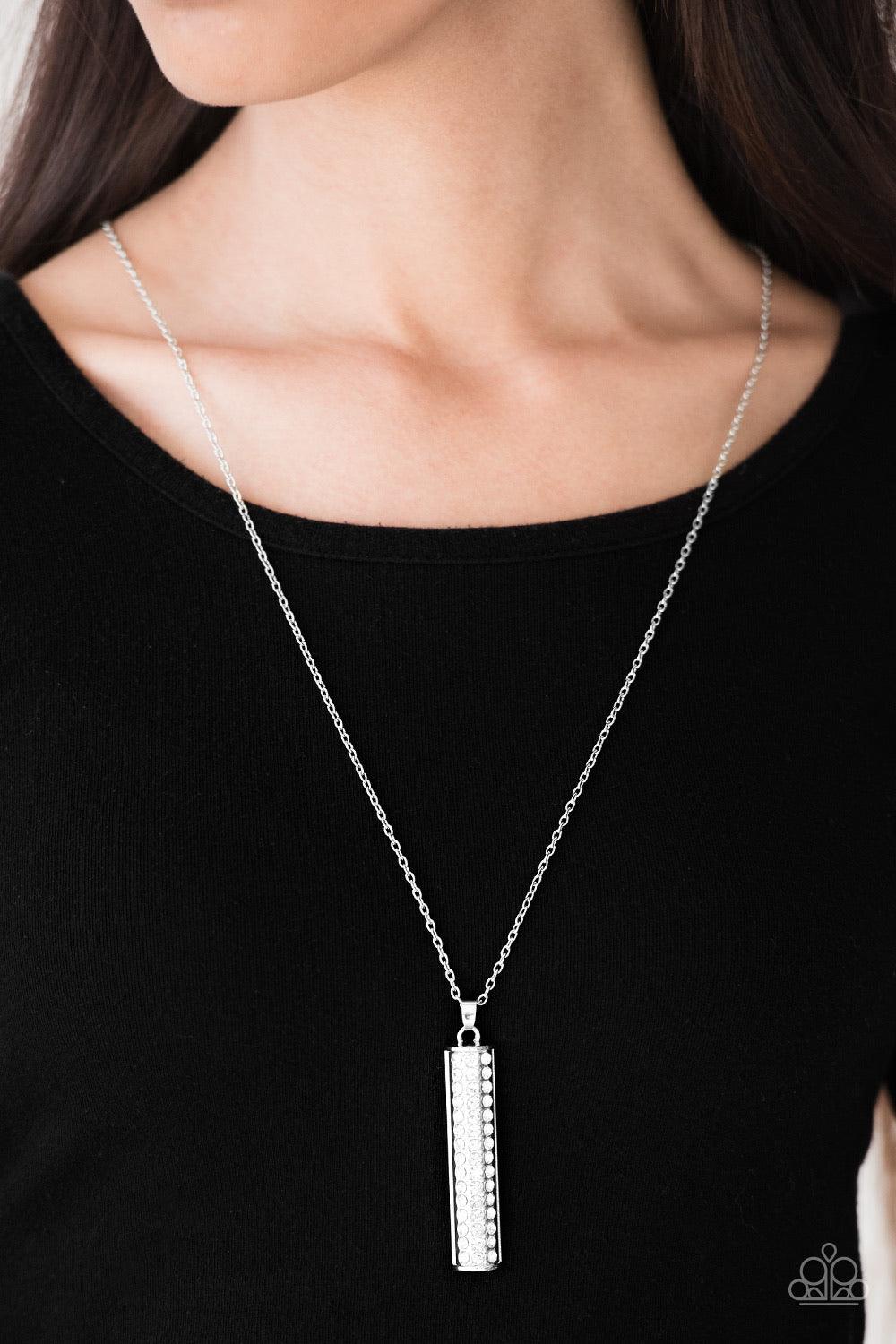 Paparazzi Accessories Big Shot Shimmer - White Featuring a rounded edge, a shimmery silver pedant is encrusted in rows of glittery white rhinestones for a dramatic look. Features an adjustable clasp closure. Sold as one individual necklace. Includes one p