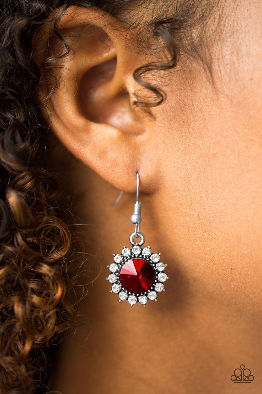 Paparazzi Accessories Bring In The BEAM Team - Red A glittery red rhinestone is pressed into a silver frame radiating with dainty white rhinestones for a glamorous look. Earring attaches to a standard fishhook fitting. Jewelry
