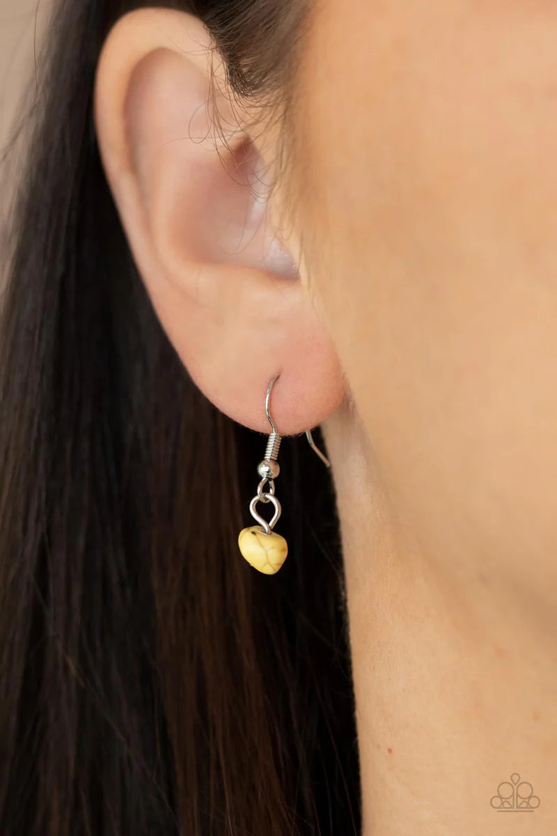 Paparazzi Accessories Plains Paradise - Yellow Adorned with yellow pebbles and hammered silver discs, three silver chains layer from strands of brown wooden beads, creating an earthy fringe below the collar. Features an adjustable clasp closure. Sold as o