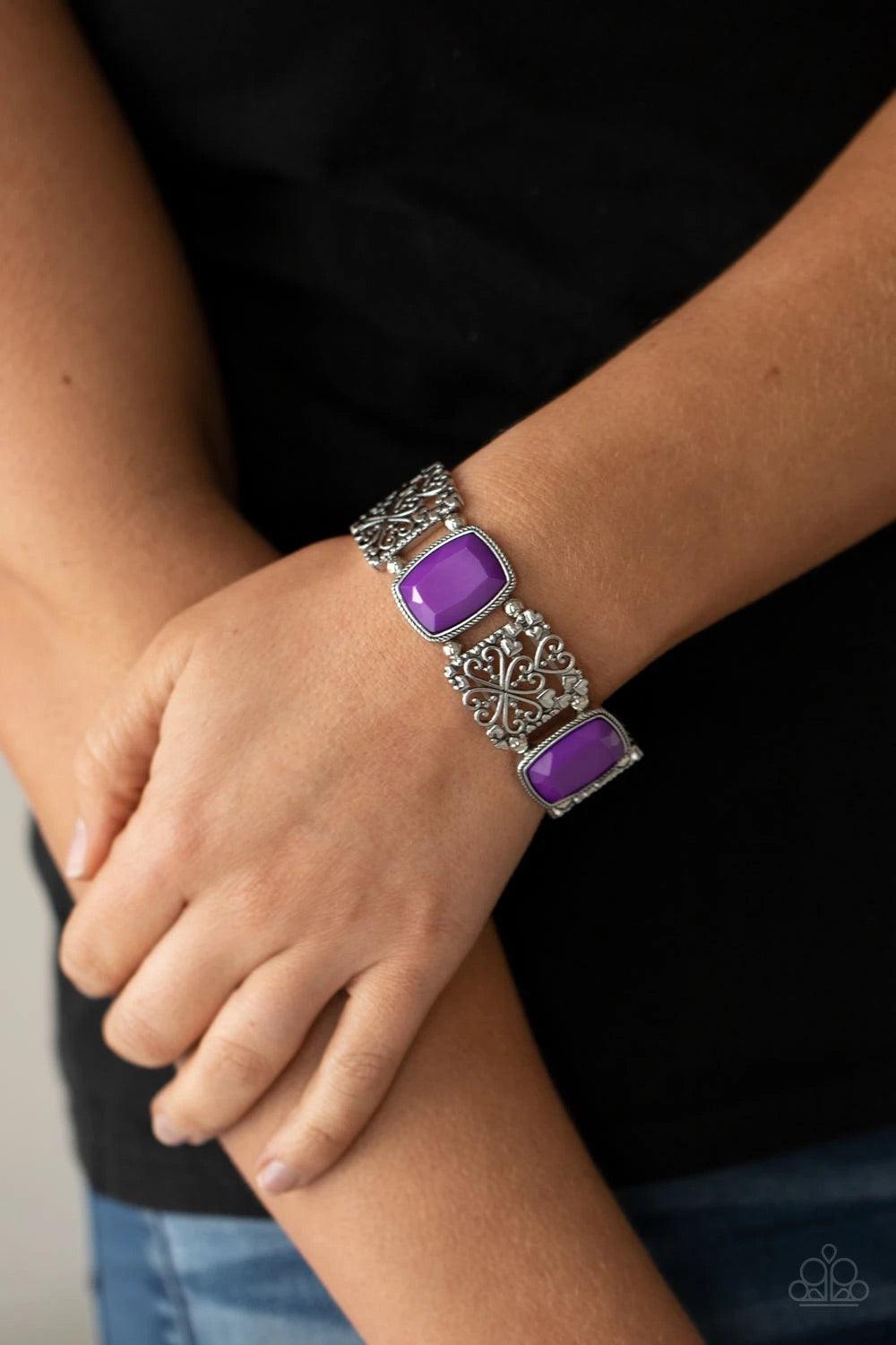 Paparazzi Accessories Colorful Coronation - Purple Infused with dainty silver heart accents, whimsically filled silver filigree frames and faceted Amethyst Orchid beads are threaded along stretchy bands around the wrist for a colorful flair. Sold as one i
