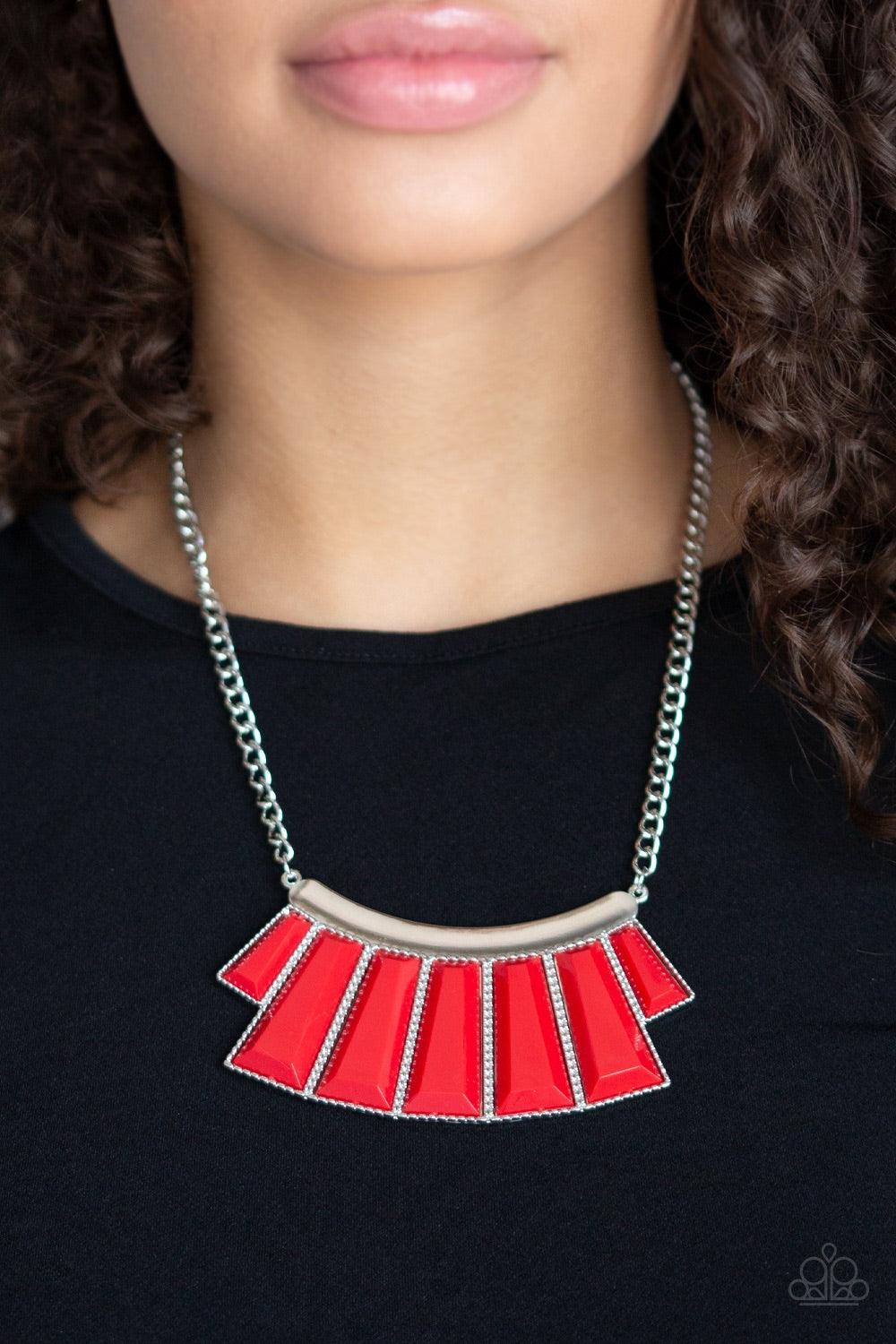 Paparazzi Accessories Glamour Goddess - Red Featuring the dramatic red hue of Chili Pepper, faceted emerald style beads are pressed into a hammered silver plate. Featuring flared bottoms, the colorful beads fan out below the collar for a fierce finish. Fe