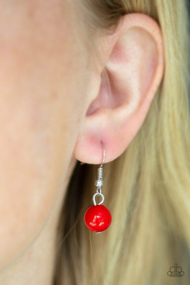 Paparazzi Accessories Egyptian Spell - Red Dramatic silver plates connect with a shiny red beaded center, creating an indigenous collar-like pendant. The shiny silver plates are delicately hammered, adding a flashy metallic texture to the tribal inspired