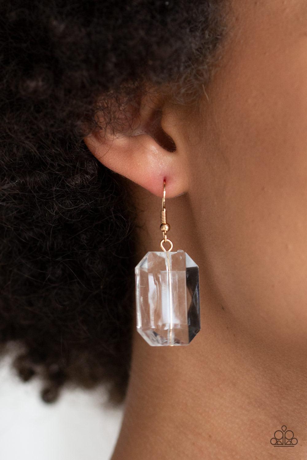 Paparazzi Accessories The ICE President - Gold Infused with dainty gold beads, glassy emerald-cut beads join below the collar for a dramatic look. Features an adjustable clasp closure. Sold as one individual necklace. Includes one pair of matching earring