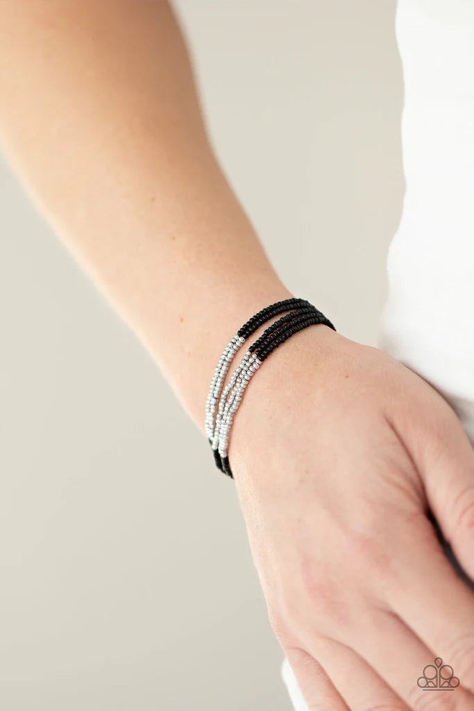 Paparazzi Accessories BEAD Bold - Black Four strands of black micro beads are accented with a bold section of silver beads for a simple yet trendy look. Features an adjustable sliding knot closure. Sold as one individual bracelet. Jewelry