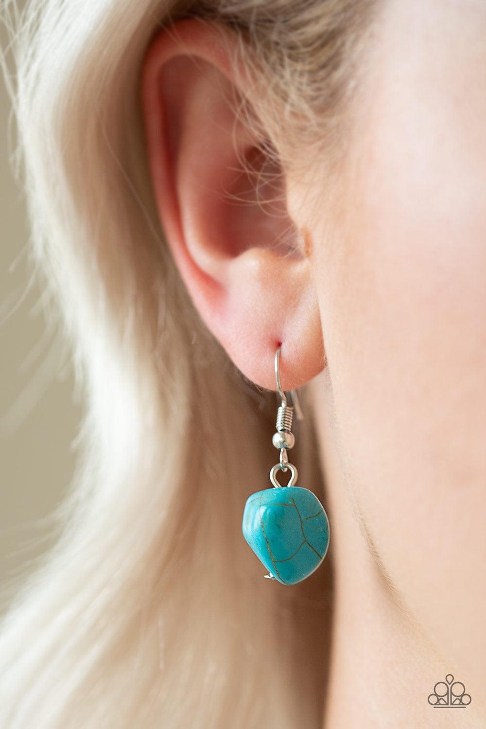 Paparazzi Accessories Stunningly Stone Age - Blue A collection of refreshing turquoise stones, shimmery silver accents, and white rhinestone encrusted rings are strung below the collar for a timeless look. Features an adjustable clasp closure. Jewelry