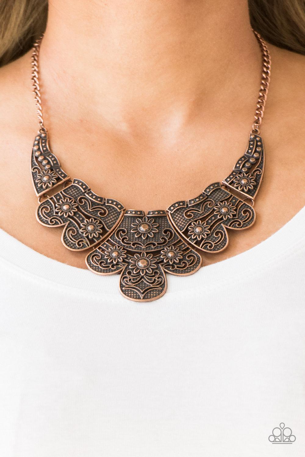 Paparazzi Accessories Mess With The Bull - Copper Embossed in whimsical floral detail, antiqued copper plates connect below the collar for a statement making look. Features an adjustable clasp closure. Sold as one individual necklace. Includes one pair of
