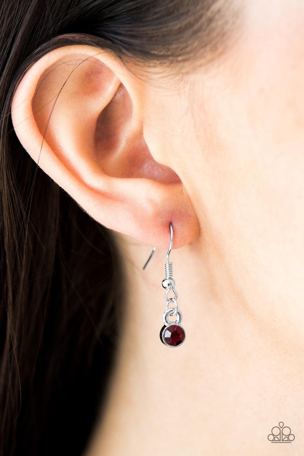 Paparazzi Accessories Moonlit Metro - Red A red gem swings from the uppermost chain above a bowing silver bar. The shimmery layers flawlessly drape below the collar in a refined fashion. Features an adjustable clasp closure. Jewelry
