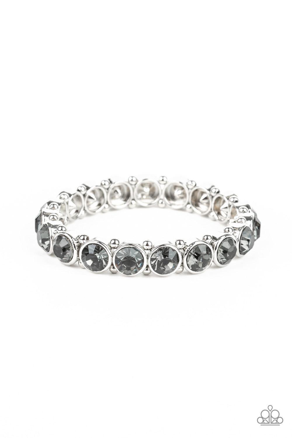 Paparazzi Accessories Sugar-Coated Sparkle - Silver Infused with dainty silver beads, smoky rhinestone encrusted frames are threaded along stretchy bands around the wrist for a glamorous look. Jewelry