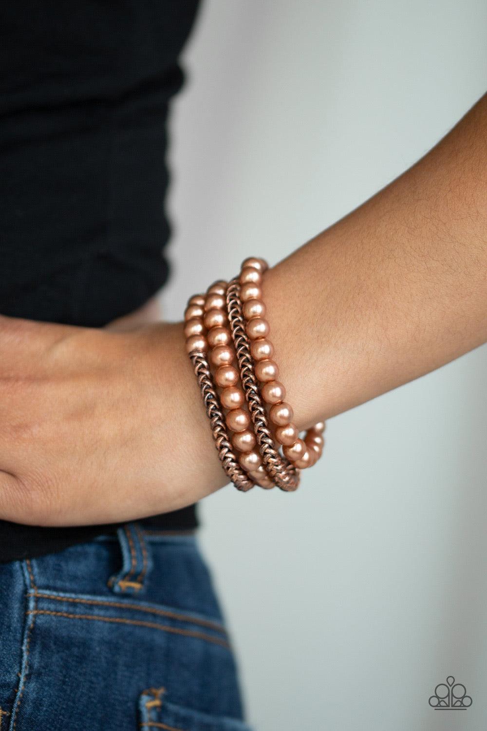 Paparazzi Accessories Industrial Incognito - Brass A collection of pearly copper beads and glistening copper chains are threaded along stretchy bands, creating a bold collision of industrial glamour. Jewelry