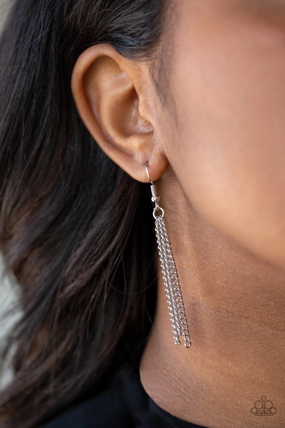 Paparazzi Accessories Diva Dance Party - White A pearl dotted frame gives way to a shimmery silver chain tassel, creating a timelessly stacked pendant at the bottom of a lengthened silver chain. Features an adjustable clasp closure. Sold as one individual