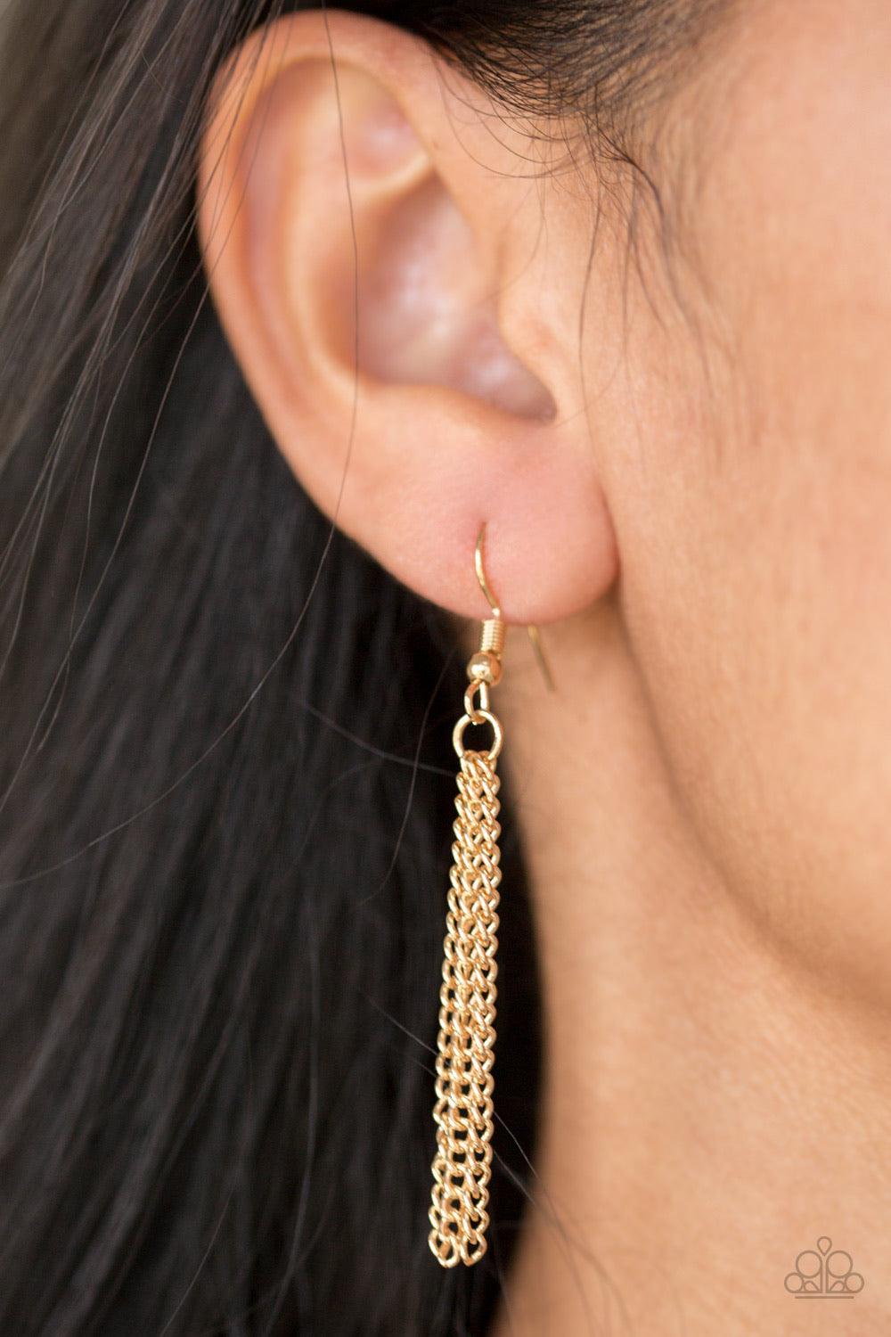 Paparazzi Accessories Shimmer Sensei - Gold Swinging from the bottom of a lengthened gold chain, a delicately hammered square frame gives way to a shimmery gold fringe. Featuring a regal square cut, a golden gem is pressed into the center of the pendant f