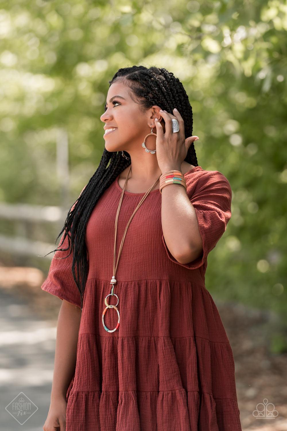 Paparazzi Accessories Rural Renovation - Multi Wrapped in sections of multicolored threaded accents, a mismatched trio of hammered silver rings link at the bottom of a beaded fitting. The earthy compilation is attached to lengthened strands of brown suede