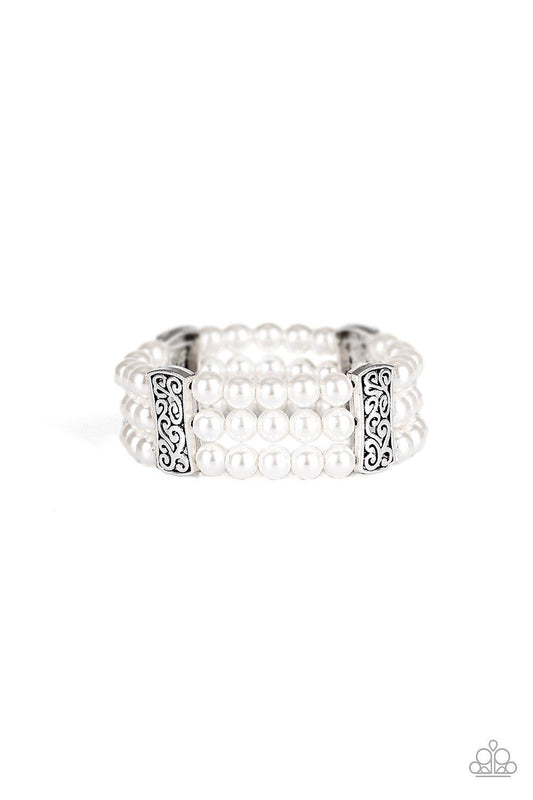 Paparazzi Accessories Ritzy Ritz - White Infused with ornate silver frames, row after row of white pearls are threaded along stretchy bands around the wrist for a refined flair. Jewelry