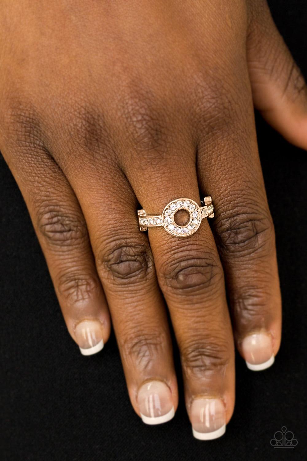Paparazzi Accessories The One And Only Sparkle - Gold Encrusted in glassy white rhinestones, a dainty gold band attaches to a round frame, creating a sparkling centerpiece atop the finger. Features a dainty stretchy band for a flexible fit. Jewelry