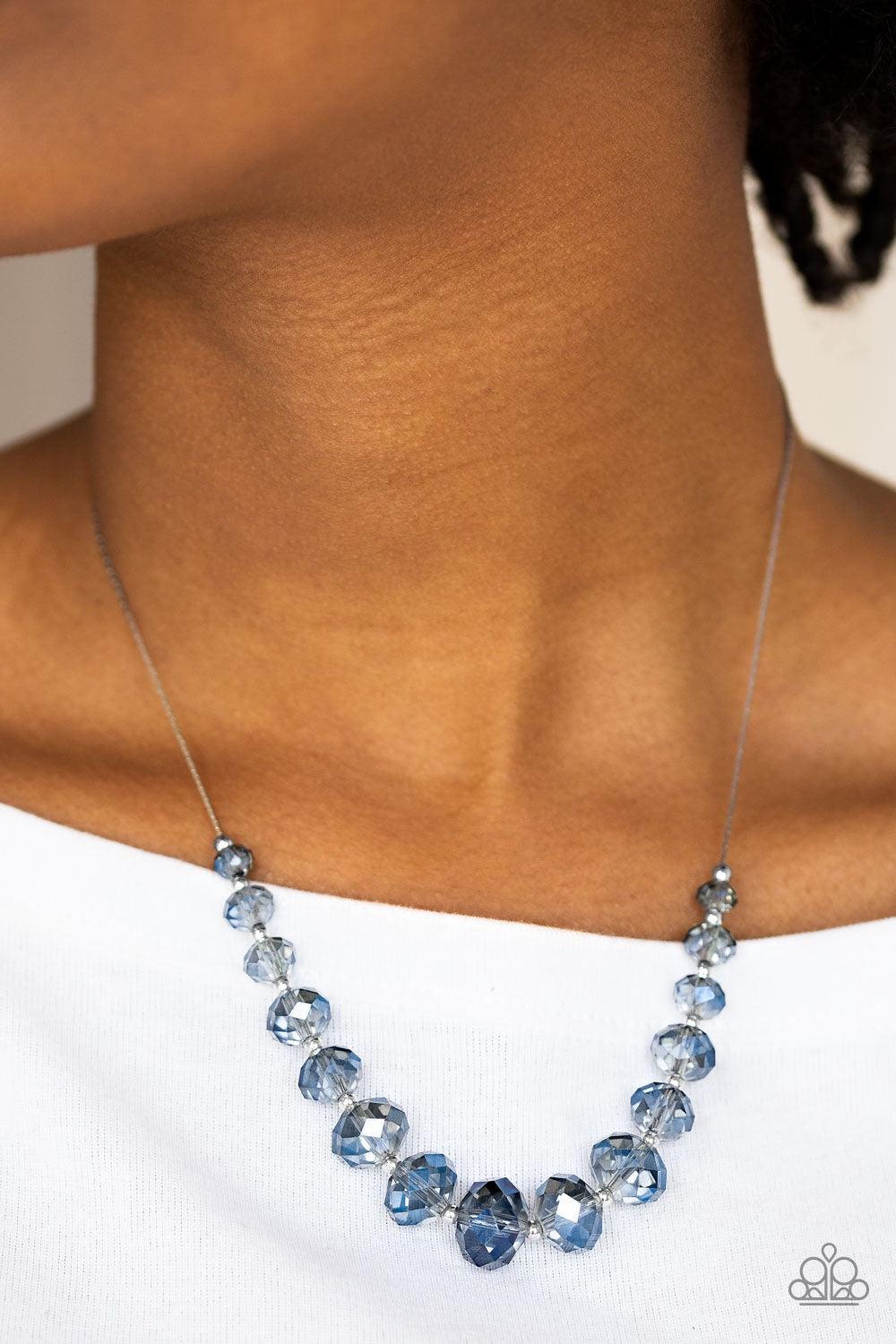 Paparazzi Accessories Crystal Carriages - Blue Iridescent blue crystal-like beads and dainty silver beads are threaded along a flat silver chain below the collar. The sparkling crystal-like beads gradually increase in size near the center for a refined fi
