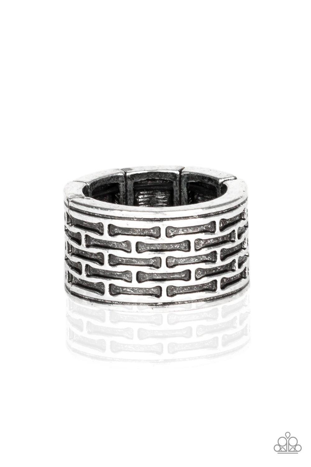 Paparazzi Accessories Tactical Gear - Silver Brushed in an antiqued finish, abstract bar-like patterns are stamped across the front of a thick silver band for a casual look. Features a stretchy band for a flexible fit. Sold as one individual ring. Jewelry