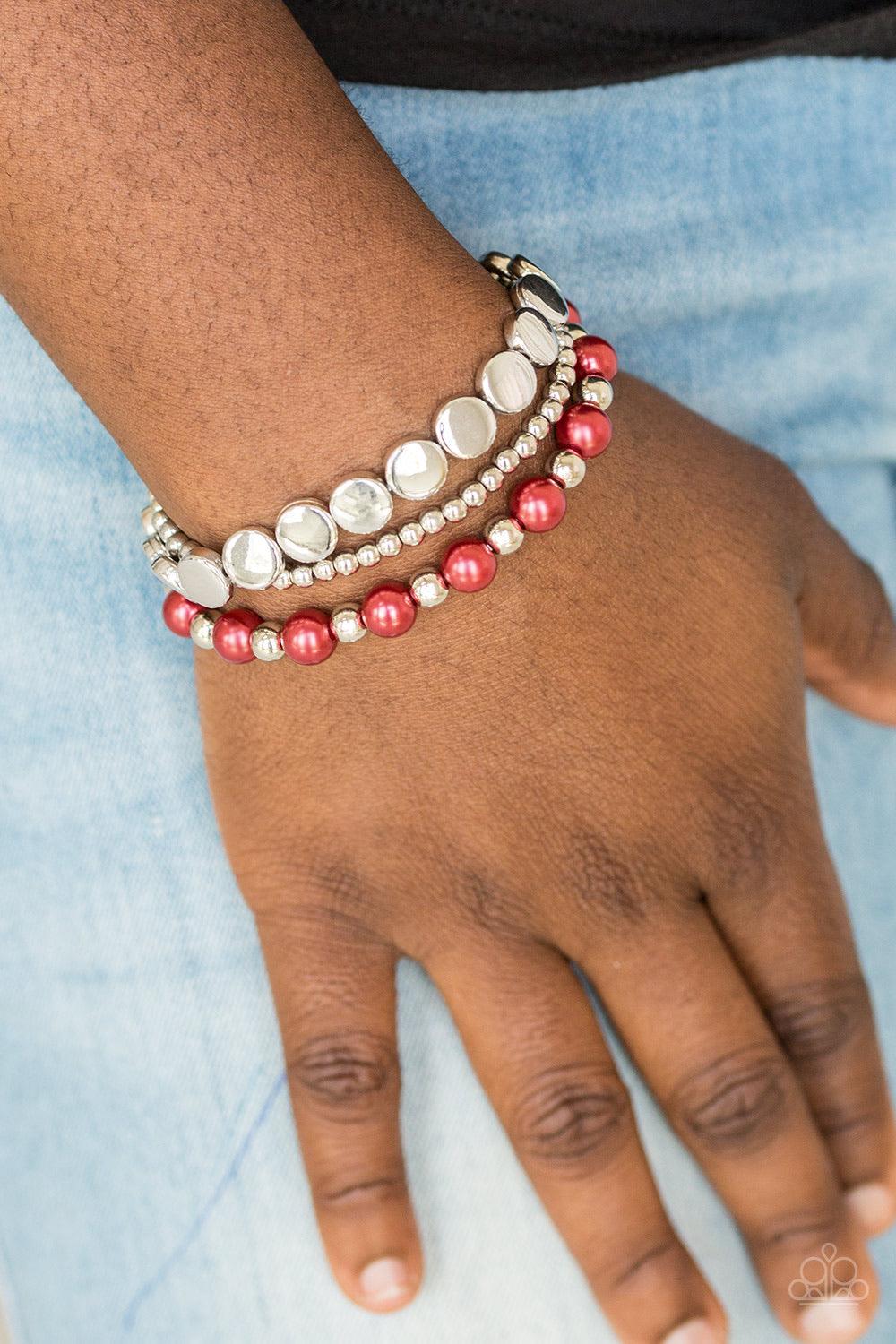 Paparazzi Accessories Girly Girl Glamour - Red Mismatched silver and pearly red beads are threaded along stretchy elastic bands, creating colorful layers across the wrist. Jewelry