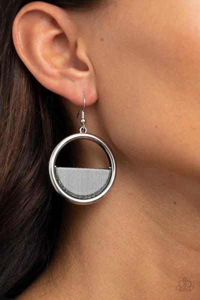 Paparazzi Accessories Stuck in Retrograde - Silver A glittering silver acrylic crescent frame is nestled on the bottom of a shiny silver hoop, coalescing into a colorfully retro frame. Earring attaches to a standard fishhook fitting. Sold as one pair of e
