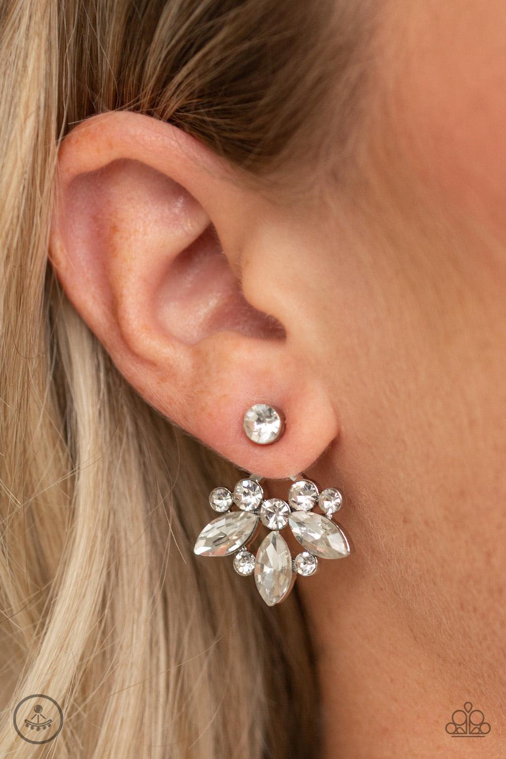 Paparazzi Accessories Crystal Constellations - White A solitaire white rhinestone attaches to a double-sided post, designed to fasten behind the ear. Radiating with a fringe of round and marquise style rhinestones, the double sided-post peeks out beneath