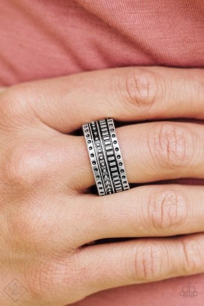 Paparazzi Accessories Roughin It - Silver Dotted and studded in tribal inspired patterns, an antiqued silver band arcs across the finger in a handcrafted, artisan inspired fashion. Features a stretchy band for a flexible fit. Jewelry