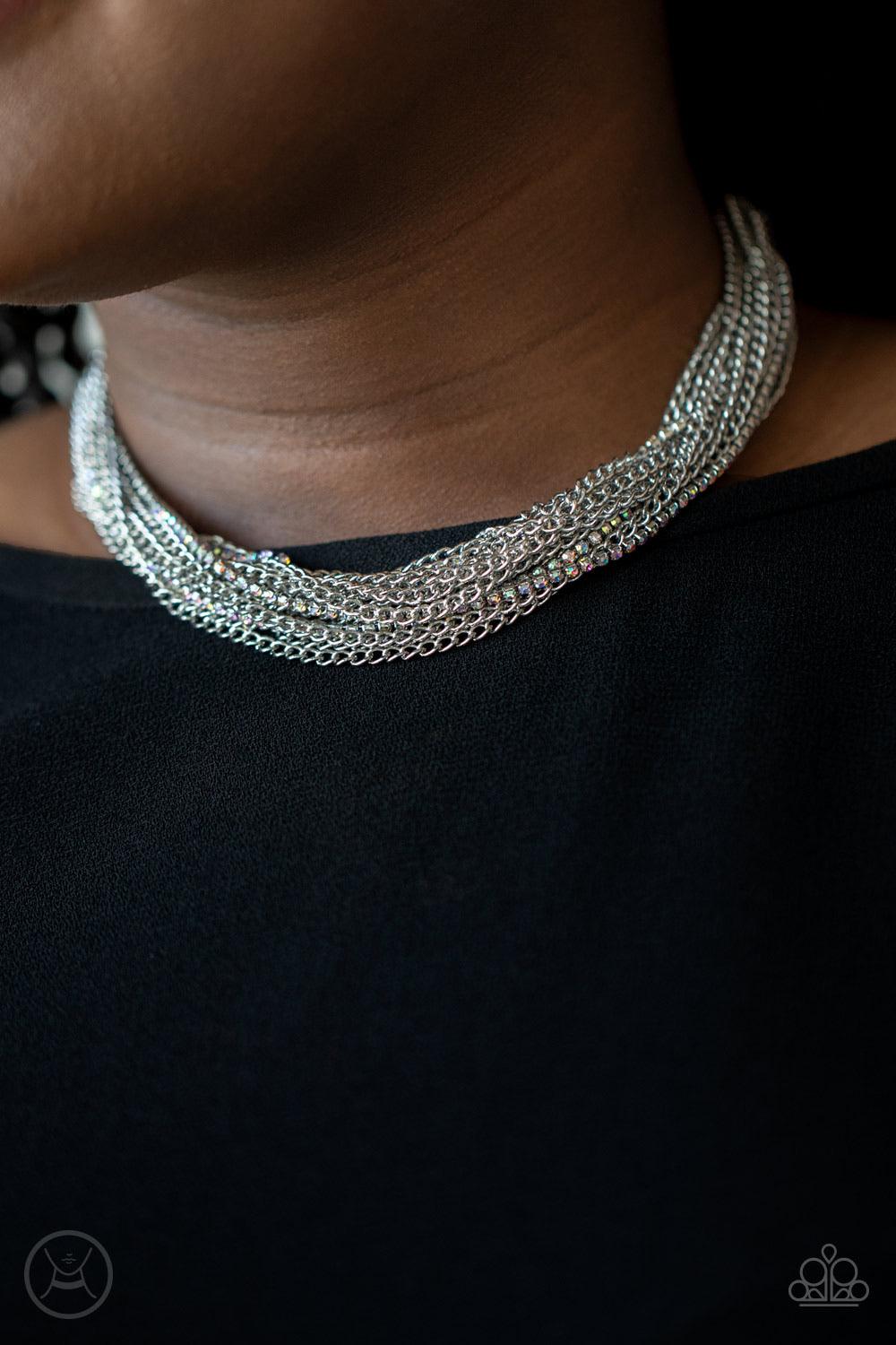 Paparazzi Accessories Catch You Layer! - Multi Hints of iridescent rhinestones peek out between layer after layer of glistening silver chains, creating a dramatic display around the neck. Features an adjustable clasp closure. Sold as one individual choker