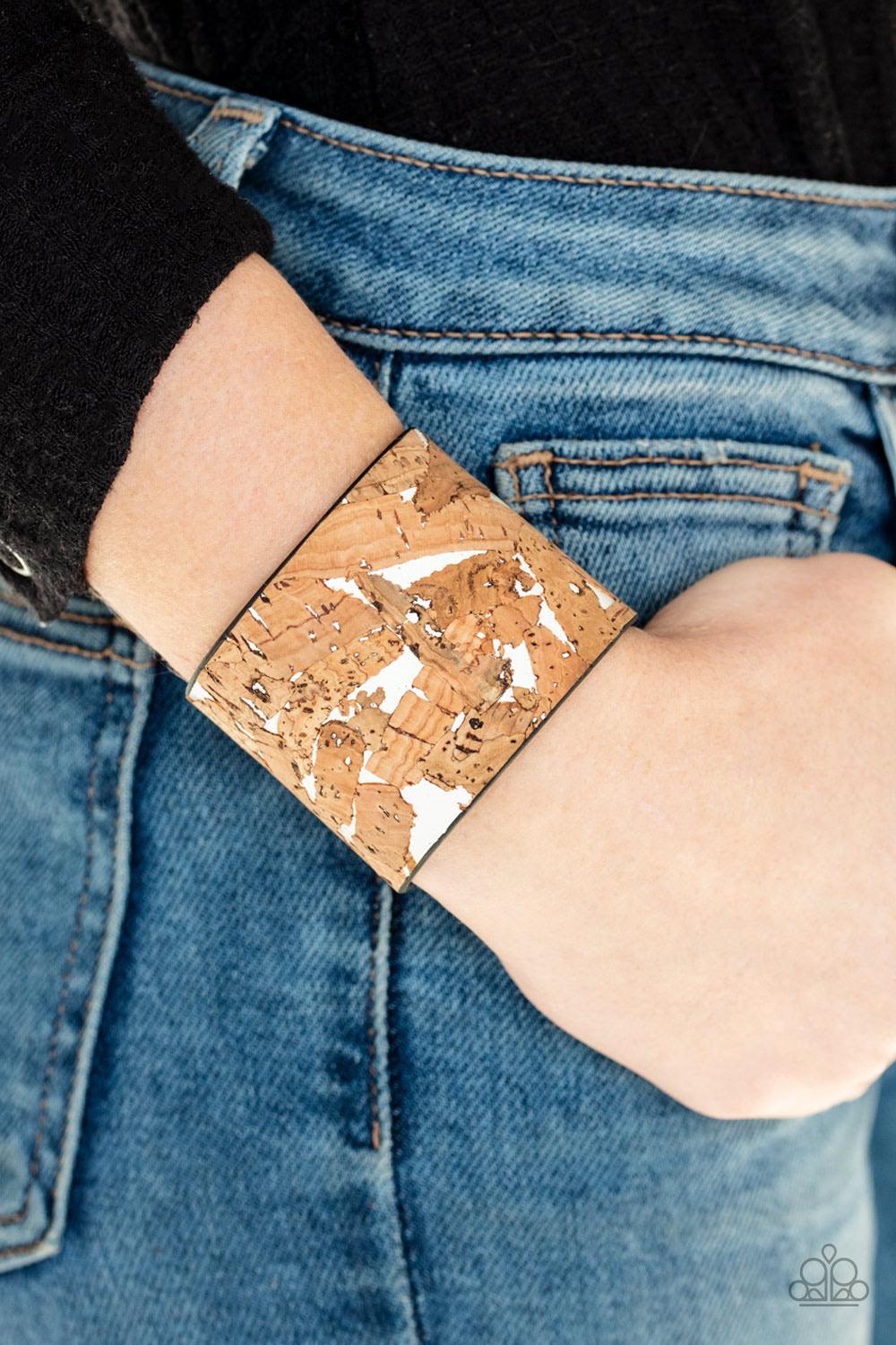 Paparazzi Accessories Cork Congo - White Pieces of cork have been plastered across the front of a shiny white leather band, creating an earthy look around the wrist. Features an adjustable snap closure. Sold as one individual bracelet. Jewelry