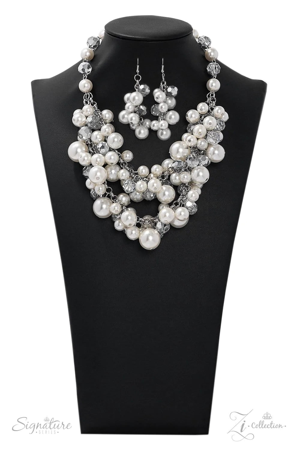 Paparazzi Accessories The Lauren A timeless collection of bubbly white pearls and faceted crystal-like beads dances along the collar in two rows of dramatic clusters. One side of the glassy crystals have been dipped in a flashy metallic finish, adding som
