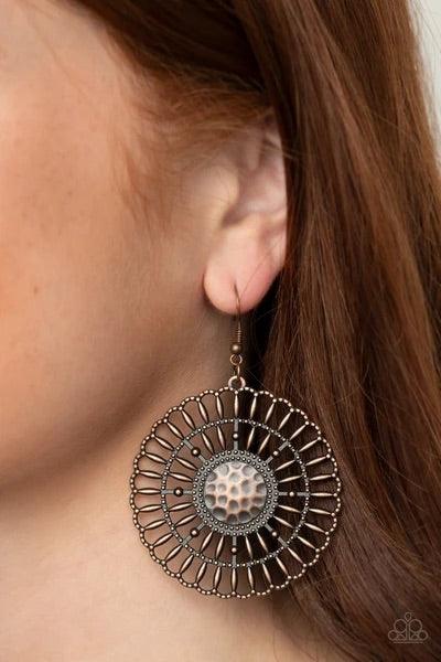 Paparazzi Accessories Rustic Groves - Copper Rustic copper bars fan out from a studded and hammered copper center, coalescing into an airy scalloped frame. Earring attaches to a standard fishhook fitting. Sold as one pair of earrings. Jewelry