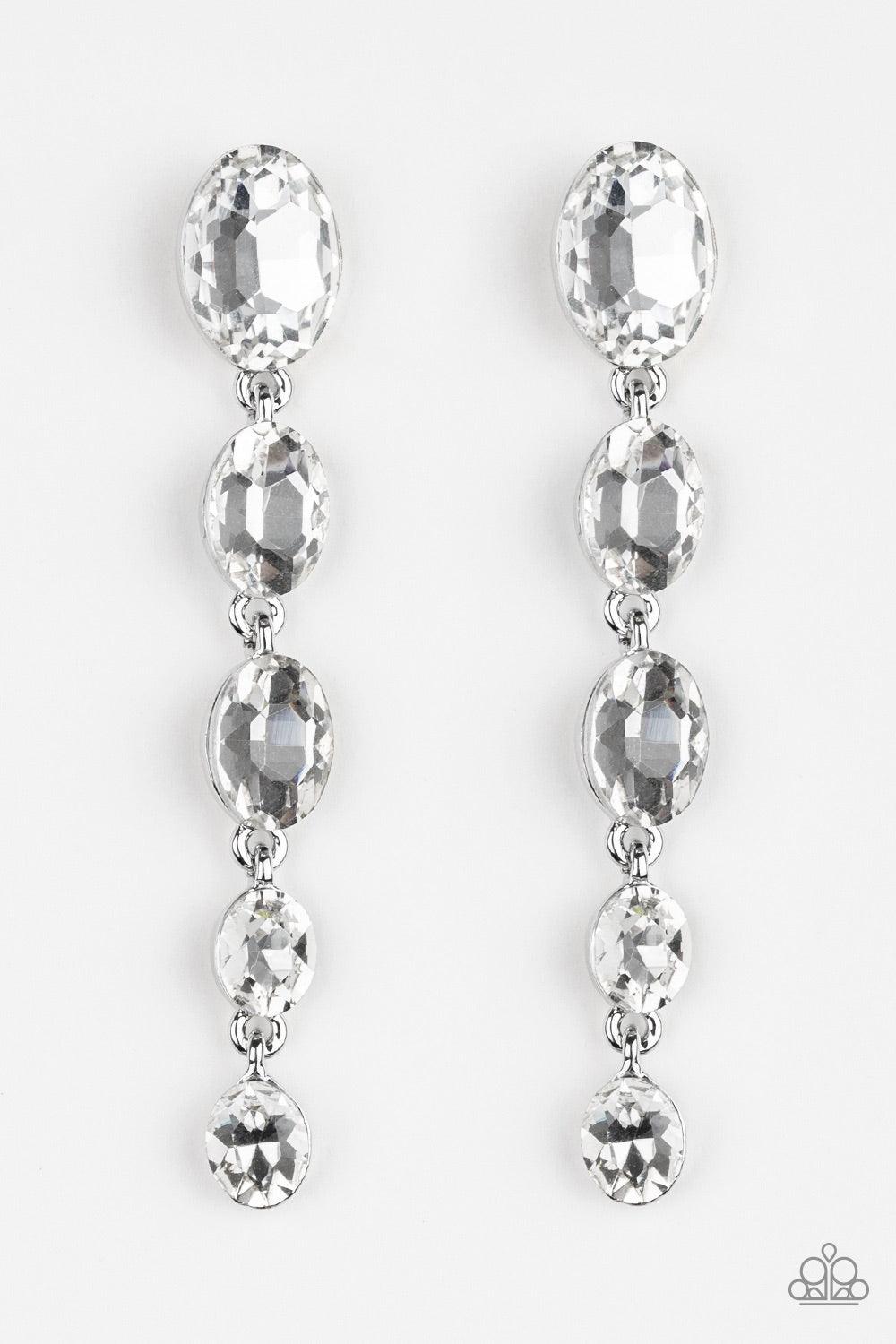 Paparazzi Accessories Red Carpet Radiance - White Gradually decreasing in size, glittery white gems trickle from the ear in a glamorous fashion. Earring attaches to a standard post fitting. Jewelry