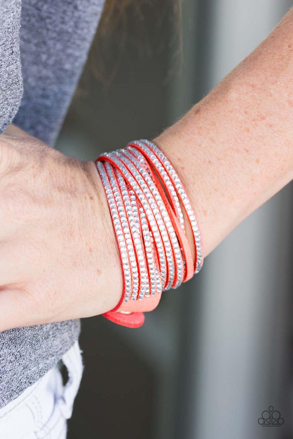 Paparazzi Accessories Do The Hustle - Orange Orange suede is spliced into six strands and embellished with rows of white rhinestones for a glitzy combination. The elongated suede band allows for a trendy double wrap design. Features an adjustable snap clo