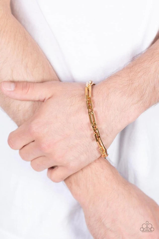Paparazzi Accessories Stratosphere Gear - Gold A shiny assortment of flat rectangular and square gold links daringly interlocks around the wrist, resulting in a bold industrial centerpiece. Features an adjustable clasp closure. Bracelets