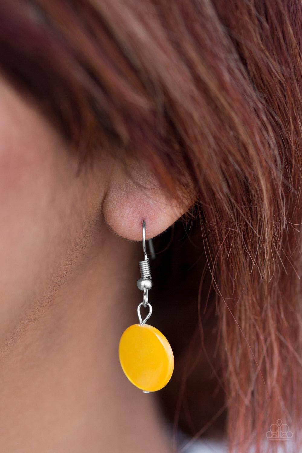 Paparazzi Accessories Coastal Adventure - Yellow Brushed in a shell-like iridescence, shiny yellow beading swings from the bottom of bold silver hoops, creating a colorful fringe below the collar. Features an adjustable clasp closure. Jewelry
