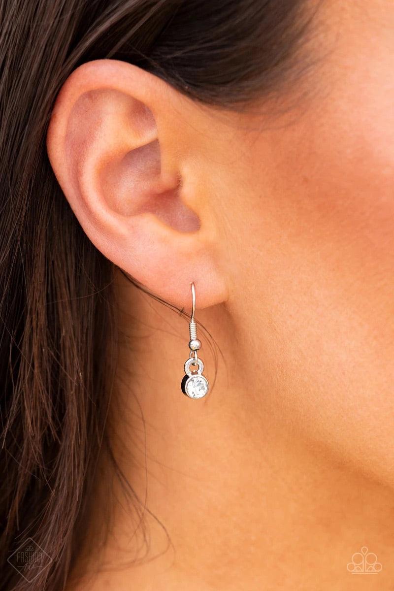 Paparazzi Accessories Frozen Gardens ~Blue Dotted in glittery white rhinestones, leafy silver frames nestle around a glowing Classic Blue cat's eye teardrop center, creating a regal pendant at the bottom of a lengthened silver chain. Features an adjustabl