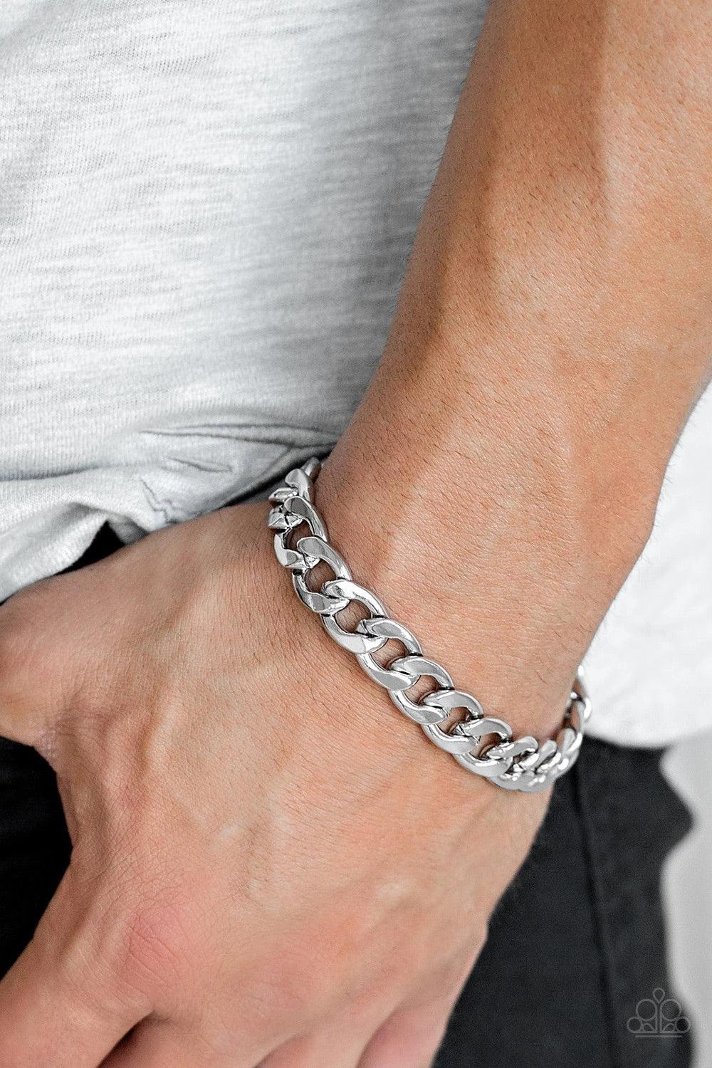 Paparazzi Accessories Leader Board - Silver A thick strand of silver curb link chain is wrapped around the wrist for a classic look. Features an adjustable clasp closure. Sold as one individual bracelet. Jewelry