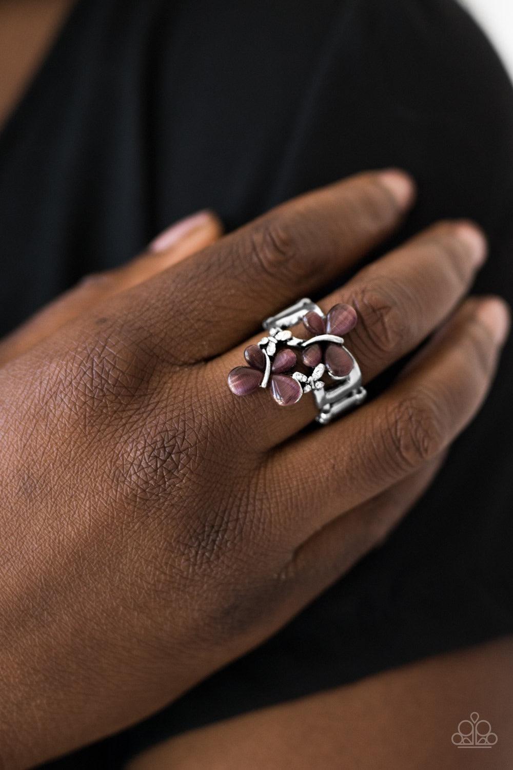 Paparazzi Accessories Butterfly Bungalow - Purple Silver butterflies swoop across the finger, coalescing into a beautiful bouquet. Glittery white rhinestones and luminescent purple moonstones are pressed into the enchanting wings for a whimsical finish. J