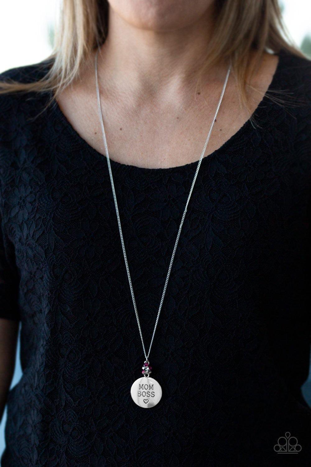 Paparazzi Accessories Mom Boss - Pink Infused with a cluster of glassy pink rhinestones, a shimmery silver disc is stamped with the inspirational phrase, "Mom Boss", for a whimsical look. Features an adjustable clasp closure. Sold as one individual neckla
