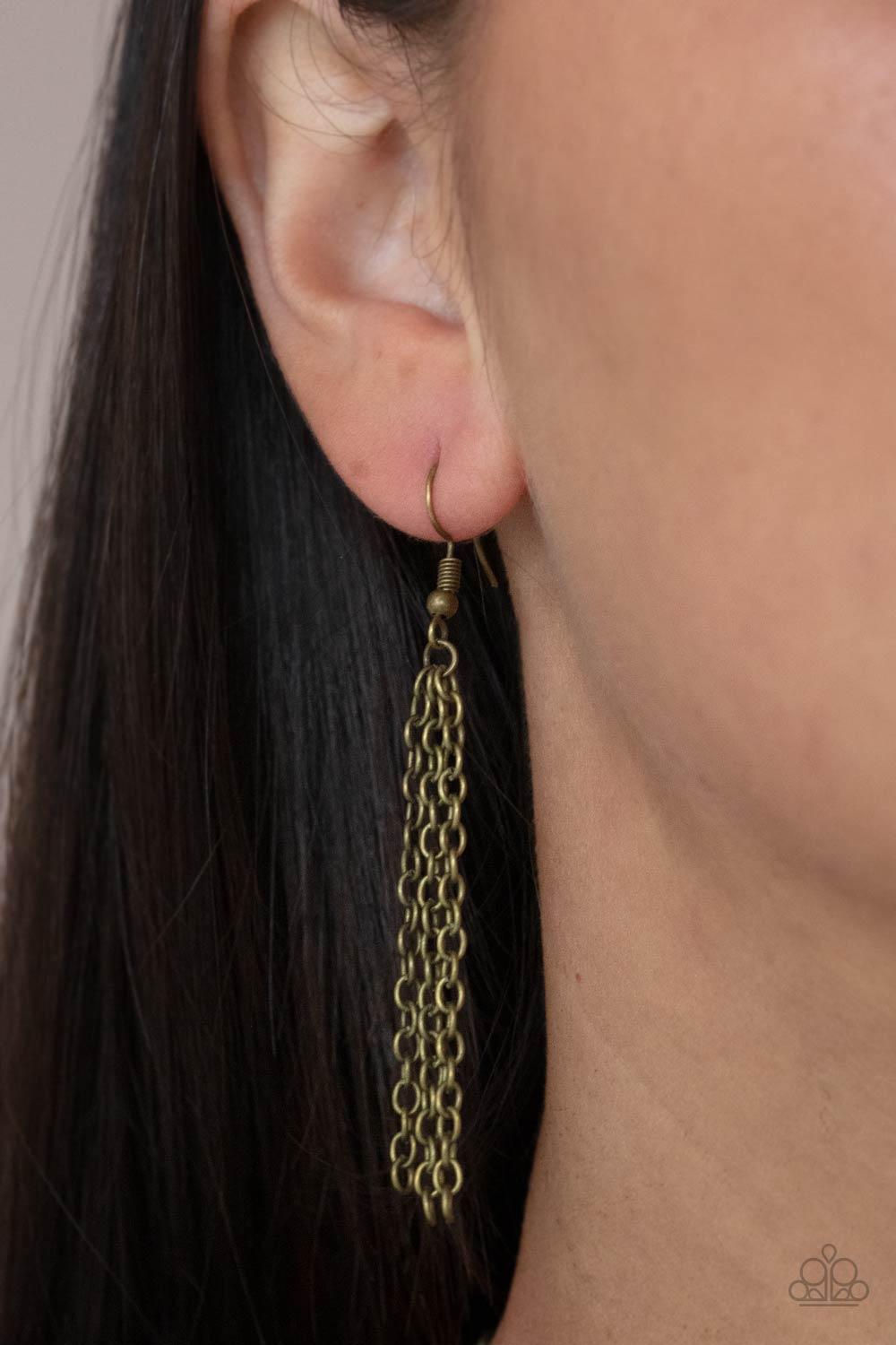Paparazzi Accessories Gallery Relic - Brass Attached to bar-like plates, mismatched brass oval plates link below the collar, creating an intense industrial statement below the collar. Features an adjustable clasp closure. Sold as one individual necklace.