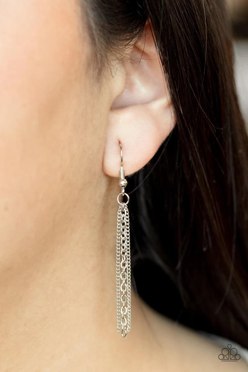 Paparazzi Accessories Towering Twinkle - White As if rolled in glitter, a chain of glassy white rhinestones spins tightly into a rounded silver pendant that swings from the bottom of a lengthened silver chain. A shimmery silver tassel dangles from the bot