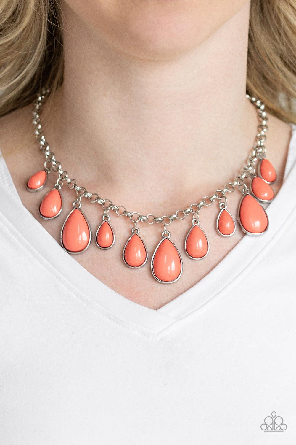 Paparazzi Accessories Jaw-Dropping Diva - Orange Encased in sleek silver frames, Living Coral teardrop beads drip from the bottom of a shimmery silver chain, creating a refreshing fringe below the collar. Features an adjustable clasp closure. Sold as one